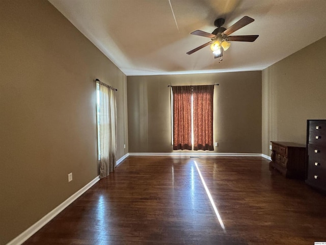 1422 N 3rd, Quincy, IL 62301 - empty room with ceiling fan and dark wood-style floors
