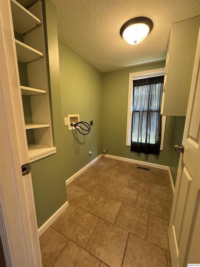 1422 N 3rd, Quincy, IL 62301 - laundry area with hookup for a washing machine, hookup for an electric dryer, hookup for a gas dryer, and a textured ceiling