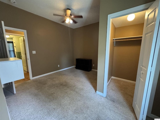 1422 N 3rd, Quincy, IL 62301 - unfurnished bedroom with carpet flooring, a closet, and a ceiling fan