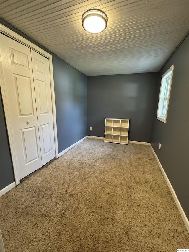 1422 N 3rd, Quincy, IL 62301 - empty room featuring carpet floors and wood ceiling
