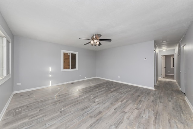 1923 Revere St, Chicago Heights, IL 60411 - empty room with ceiling fan and wood finished floors