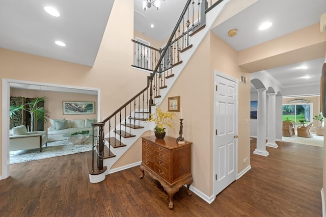 21705 W Hilandale Ct, Kildeer, IL 60047 - stairway featuring ornate columns, wood finished floors, ornamental molding, arched walkways, and recessed lighting