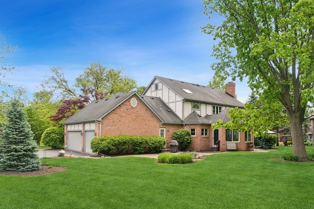21705 W Hilandale Ct, Kildeer, IL 60047 - view of front of property featuring brick siding, a chimney, a front lawn, an attached garage, and concrete driveway