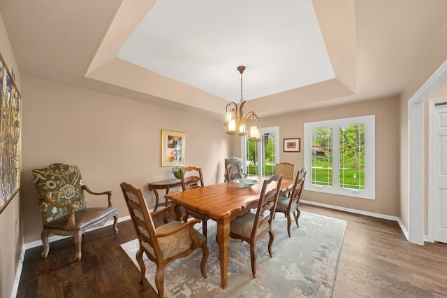 21705 W Hilandale Ct, Kildeer, IL 60047 - dining space with a tray ceiling, wood finished floors, and a chandelier