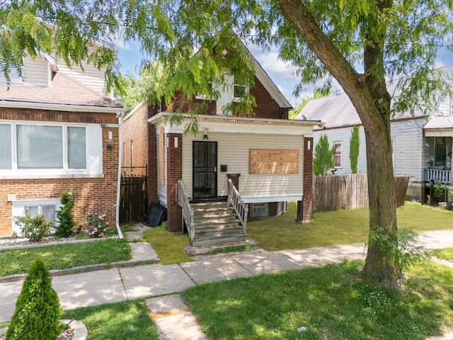 7125 S Sangamon St, Chicago, IL 60621 - view of front of house featuring brick siding and a porch