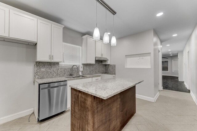 7125 S Sangamon St, Chicago, IL 60621 - kitchen with stainless steel dishwasher, tasteful backsplash, recessed lighting, white cabinetry, and light stone counters