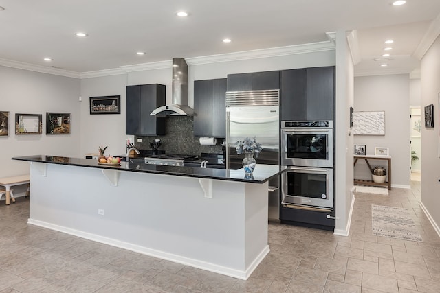 1825 N Winnebago Ave Unit 101, Chicago, IL 60647 - kitchen featuring wall chimney range hood, appliances with stainless steel finishes, a kitchen bar, dark cabinetry, and ornamental molding