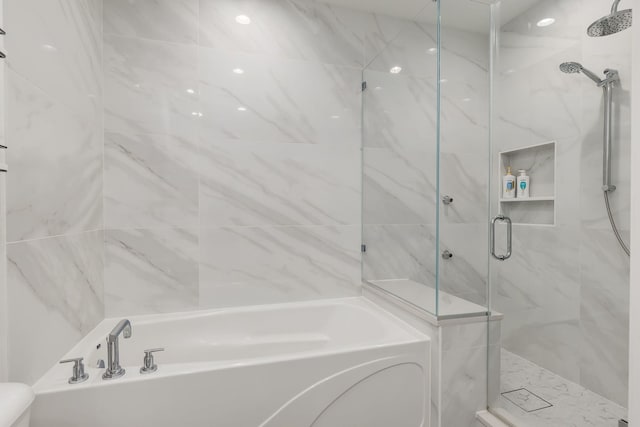 1825 N Winnebago Ave Unit 101, Chicago, IL 60647 - bathroom featuring a bath and a marble finish shower