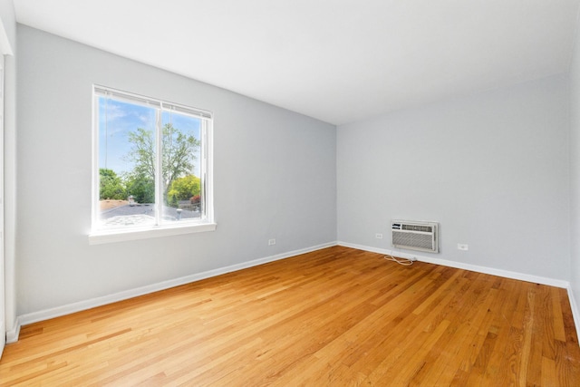 9516 S Kildare Ave Unit 3S, Oak Lawn, IL 60453 - unfurnished room featuring a wall mounted AC and light wood-type flooring