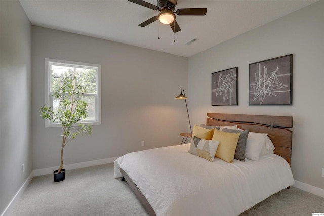 1418 N 6th, Quincy, IL 62301 - carpeted bedroom featuring baseboards and ceiling fan