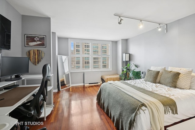 525 W Hawthorne Pl Unit 1004, Chicago, IL 60657 - bedroom with wood finished floors, an office area, and track lighting