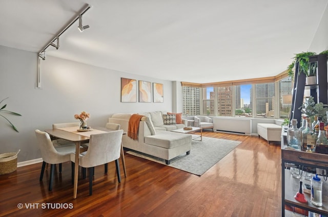 525 W Hawthorne Pl Unit 1004, Chicago, IL 60657 - dining area featuring wood finished floors, rail lighting, and a view of city