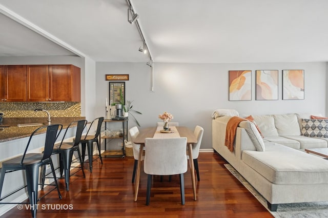 525 W Hawthorne Pl Unit 1004, Chicago, IL 60657 - dining area featuring dark wood finished floors and rail lighting