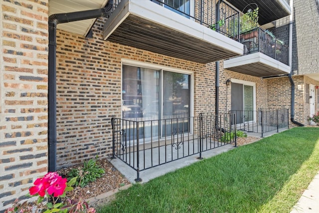 10622 Parkside Ave Unit 103, Chicago Ridge, IL 60415 - view of exterior entry with brick siding, a balcony, and a patio