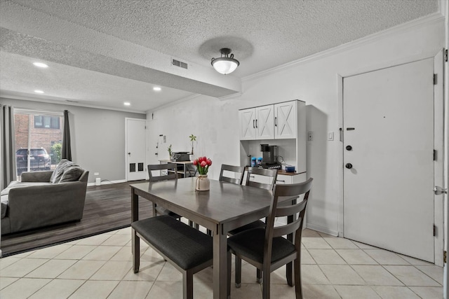 10622 Parkside Ave Unit 103, Chicago Ridge, IL 60415 - dining area with a textured ceiling, light tile patterned floors, ornamental molding, and recessed lighting