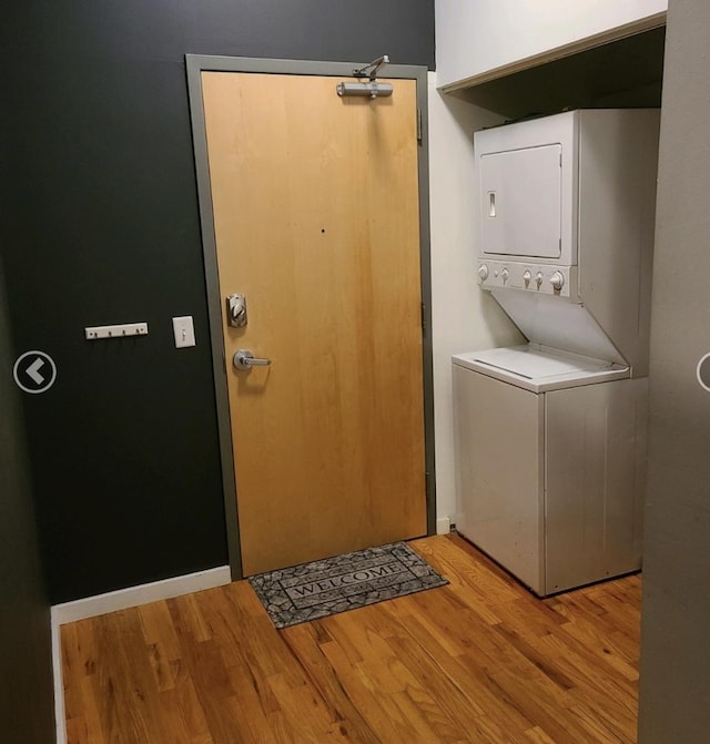 1620 S Michigan Ave Unit 424, Chicago, IL 60616 - washroom with stacked washer / dryer and light wood-style floors