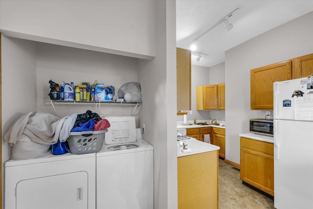 611 W White St, Champaign, IL 61820 - laundry room with rail lighting and washer and dryer