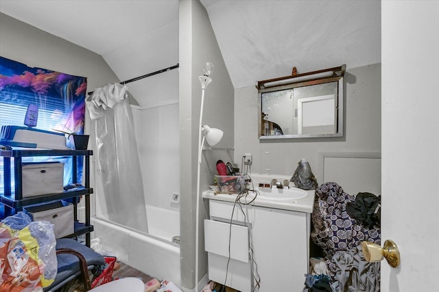 611 W White St, Champaign, IL 61820 - bathroom featuring vanity, shower / bath combo with shower curtain, and lofted ceiling