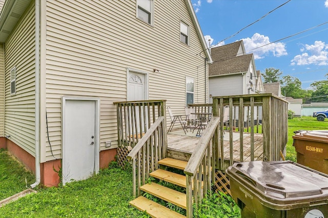 611 W White St, Champaign, IL 61820 - deck featuring a lawn