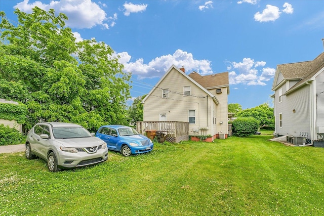 611 W White St, Champaign, IL 61820 - rear view of property with a lawn and a chimney
