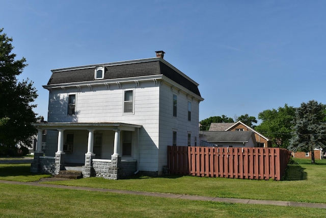 207 State St, Benson, IL 61516 - view of front of house with covered porch and mansard roof