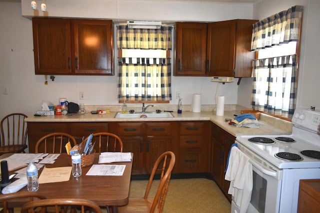 207 State St, Benson, IL 61516 - kitchen featuring white electric range and light countertops