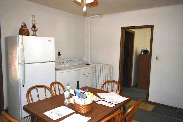 207 State St, Benson, IL 61516 - dining room with radiator heating unit, washer and clothes dryer, and a ceiling fan