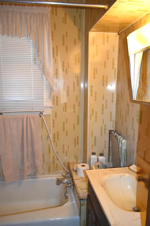 207 State St, Benson, IL 61516 - bathroom featuring wallpapered walls, vanity, and radiator heating unit