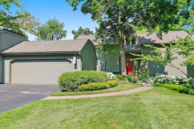 434C Woodview Rd Unit C, Lake Barrington, IL 60010 - view of front of home featuring a front lawn, asphalt driveway, a garage, and roof with shingles