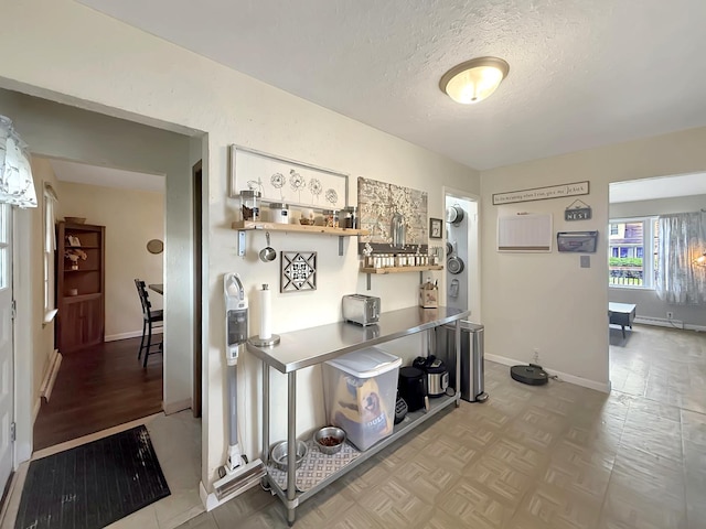 1639 S Highland Ave, Freeport, IL 61032 - hallway with a textured ceiling and baseboards