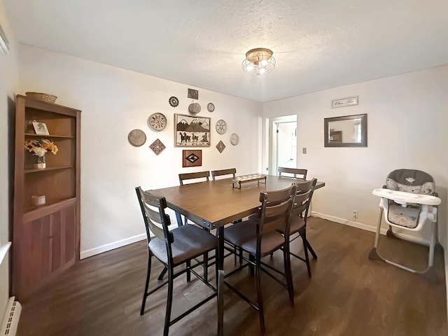 1639 S Highland Ave, Freeport, IL 61032 - dining room with a baseboard heating unit and dark wood-type flooring