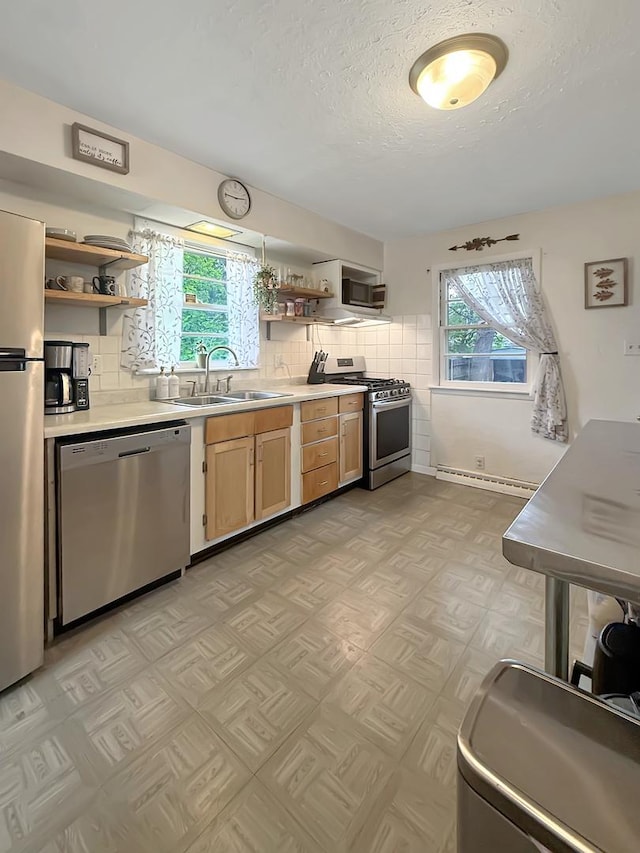 1639 S Highland Ave, Freeport, IL 61032 - kitchen featuring stainless steel appliances, open shelves, plenty of natural light, and a textured ceiling