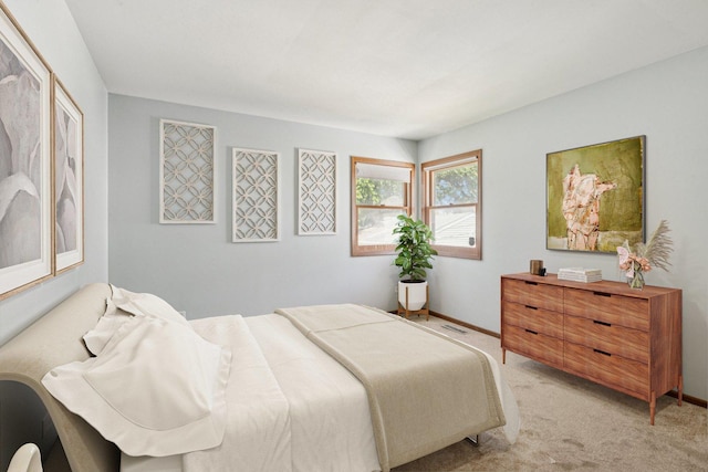 1228 N Lake Shore Dr, Round Lake Beach, IL 60073 - bedroom with light carpet and baseboards