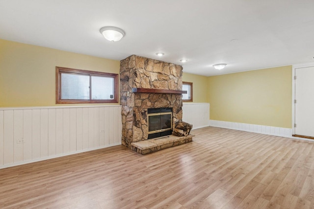 1228 N Lake Shore Dr, Round Lake Beach, IL 60073 - unfurnished living room featuring light wood-type flooring and a fireplace
