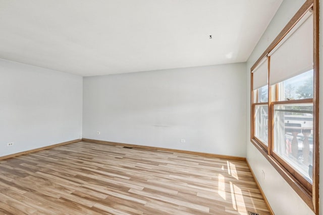 1228 N Lake Shore Dr, Round Lake Beach, IL 60073 - unfurnished room with light wood-type flooring and baseboards