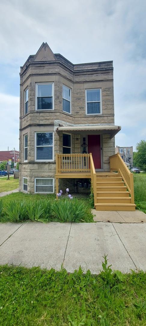 1556 S Spaulding Ave, Chicago, IL 60623 - view of front of home featuring stone siding and covered porch