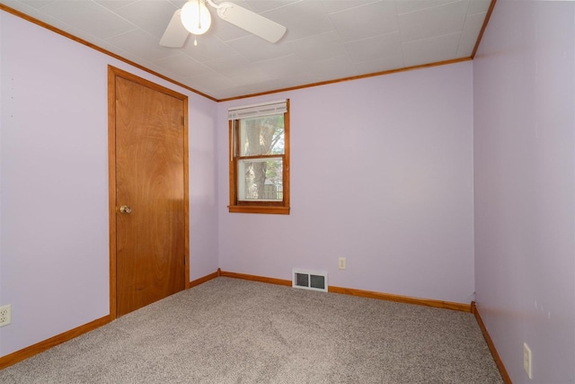 112 NW Adams St N, Hopedale, IL 61747 - empty room featuring crown molding, carpet, and ceiling fan