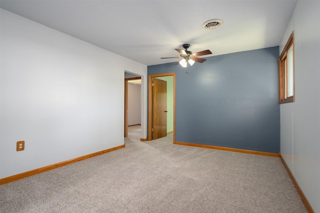 112 NW Adams St N, Hopedale, IL 61747 - empty room featuring ceiling fan and light carpet
