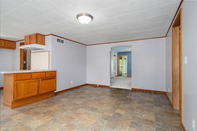 112 NW Adams St N, Hopedale, IL 61747 - unfurnished living room with arched walkways and stone finish flooring