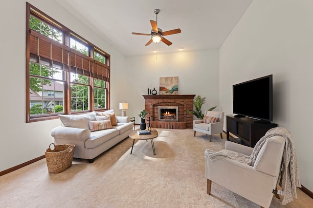 609 Spruce Ct, Oswego, IL 60543 - carpeted living room with ceiling fan and a brick fireplace