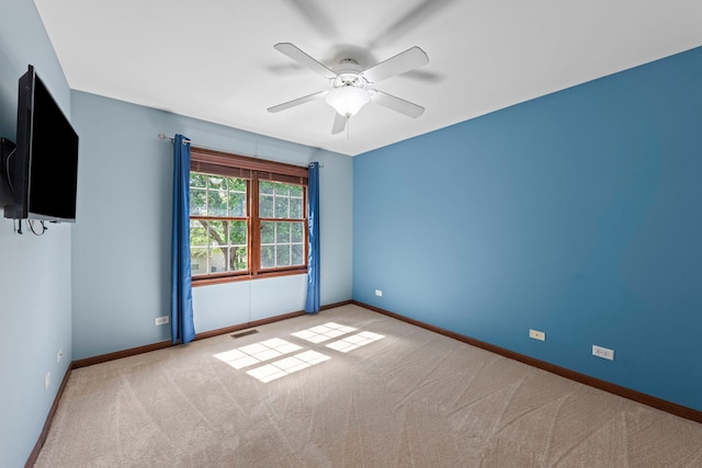 609 Spruce Ct, Oswego, IL 60543 - carpeted empty room featuring baseboards and ceiling fan
