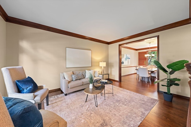 609 Spruce Ct, Oswego, IL 60543 - living area with crown molding, wood finished floors, and a chandelier