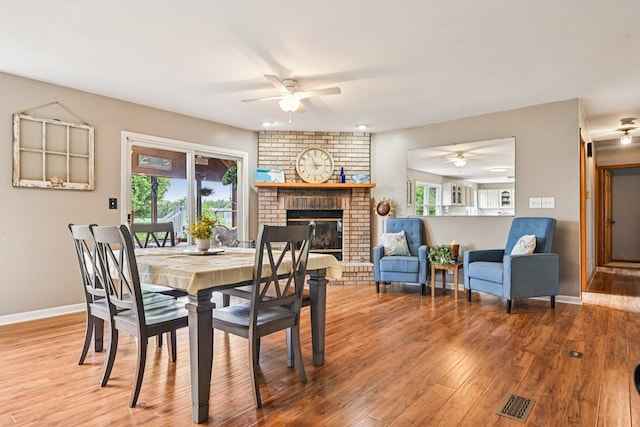 6180 Elm St, Union, IL 60180 - dining area with ceiling fan, wood finished floors, and a brick fireplace