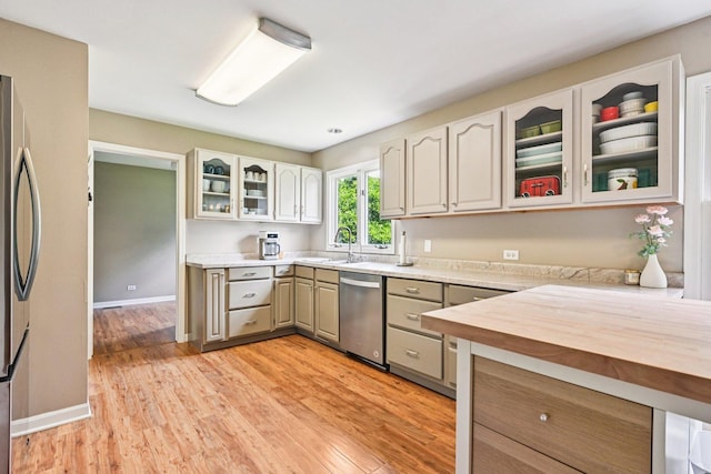 6180 Elm St, Union, IL 60180 - kitchen featuring appliances with stainless steel finishes, light wood-style floors, glass insert cabinets, and wooden counters