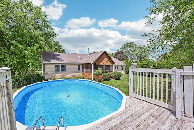 6180 Elm St, Union, IL 60180 - view of swimming pool with a sunroom, a wooden deck, and a yard