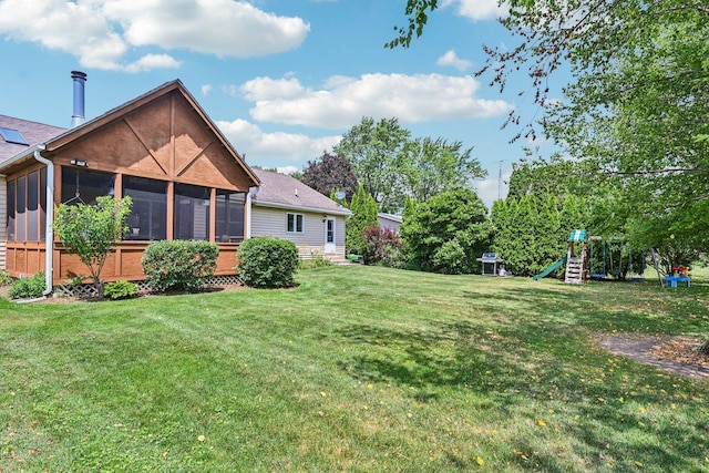 6180 Elm St, Union, IL 60180 - view of green lawn featuring a playground and a sunroom