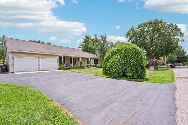 6180 Elm St, Union, IL 60180 - ranch-style house with asphalt driveway, an attached garage, and a front lawn