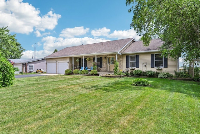 6180 Elm St, Union, IL 60180 - ranch-style house with an attached garage, covered porch, driveway, and a front lawn