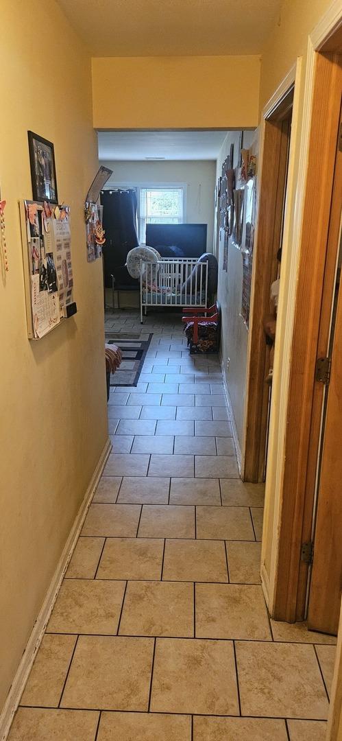 1601 44th Ave, Stone Park, IL 60165 - corridor featuring light tile patterned floors and baseboards