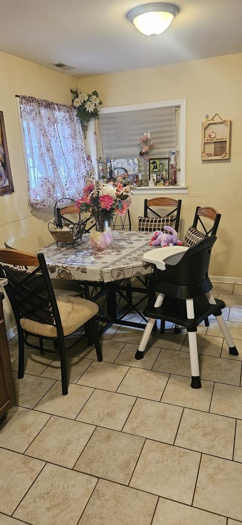 1601 44th Ave, Stone Park, IL 60165 - dining area featuring light tile patterned flooring